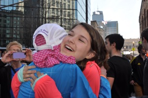 Elinor getting a hug from her daughter Martha at the Boston Marathon finish line.