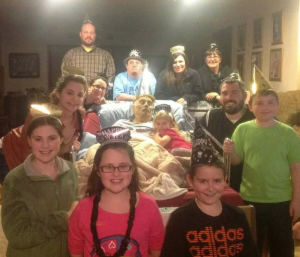 The Miller family surrounds Bill for a New Year's celebration, days before Bill's passing.