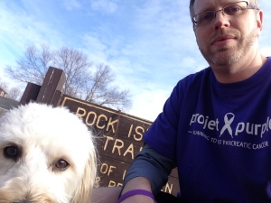 Travis wears his Project Purple gear for inspiration while on the run.