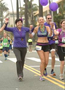 Julie running with Pancreatic Cancer fighter, Lupe Romero-De La Cruz