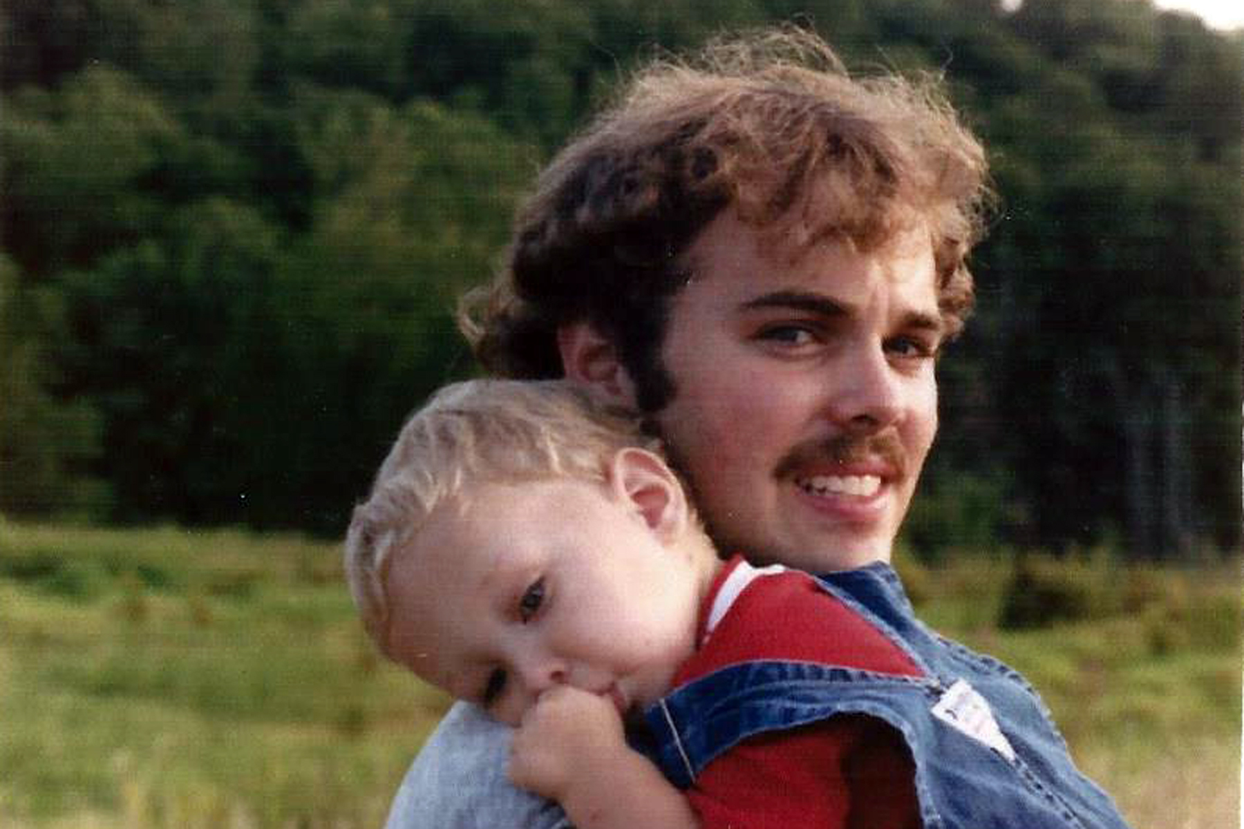 <b>Phil Reiss</b>, Sr., holding his son, Phil, Jr. - phil-dad