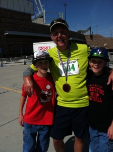 Brad with his sons at the Omaha Marathon, his first marathon finish