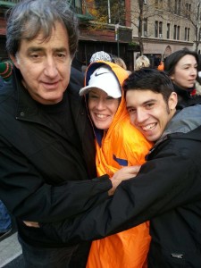 Sally getting hugs from her husband & son following the NYCM