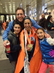 Tova with her family at the NYCM finish in 2013