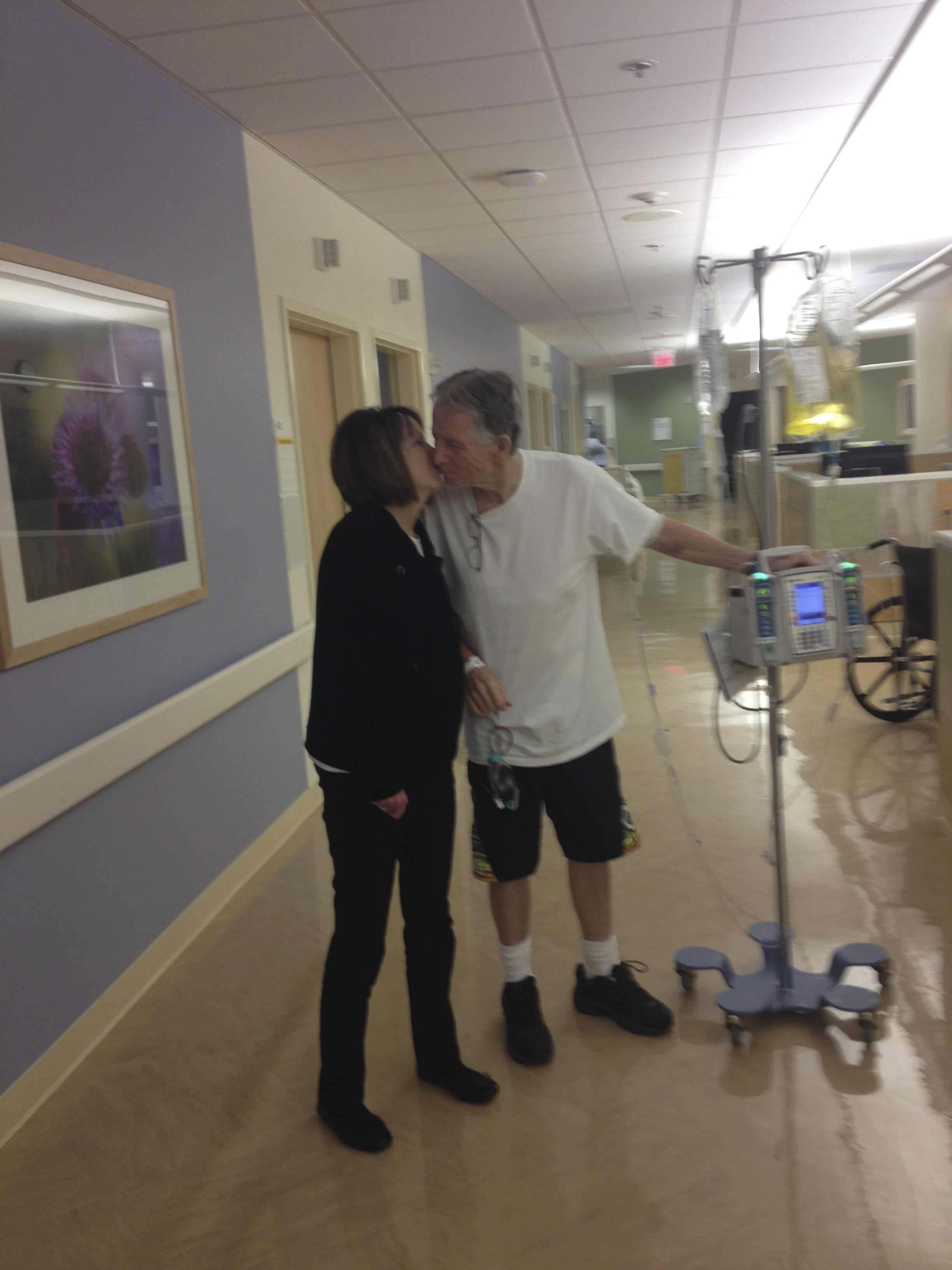 Phil and Cheryl take a moment to steal a kiss in the hospital.