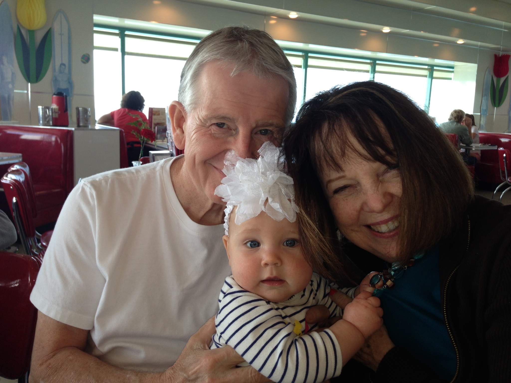 Phil with his wife, Cheryl, and granddaughter Claire.