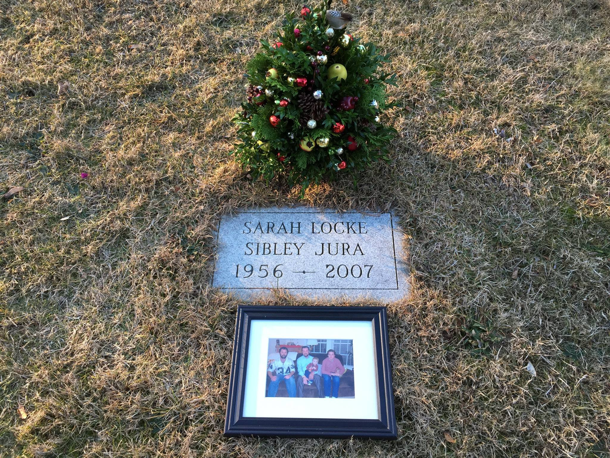 Jura family photo next to Sarah's grave.