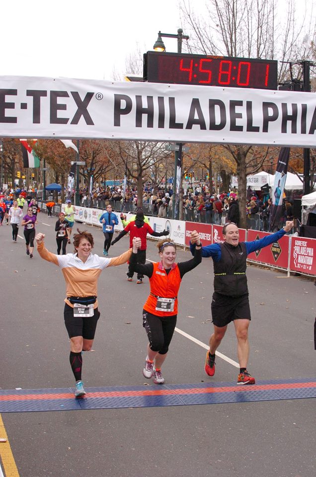 Fayne, Shay and Roger Frey crossing the finish line of the Philadelphia Marathon